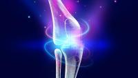 Graphic of knee bones surrounded by blue and purple light